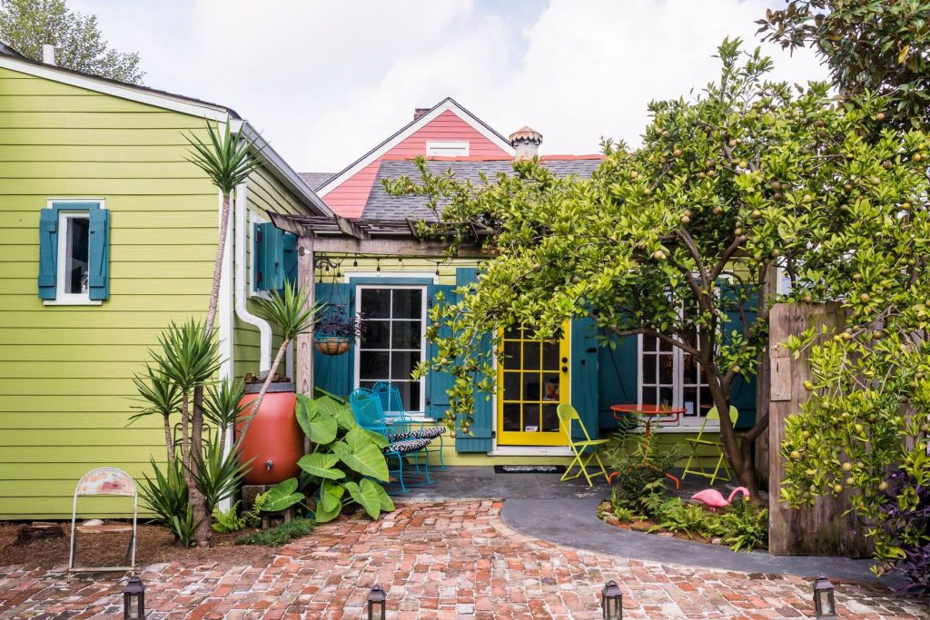 Photo of a colorful Creole Style Cottage Airbnb in New Orleans. 