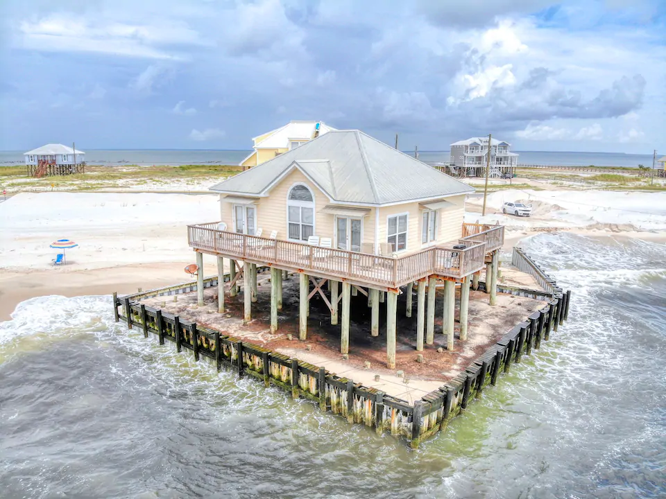 the pylon raised exterior of Villa Delphinus, one of the best airbnbs in Alabama 