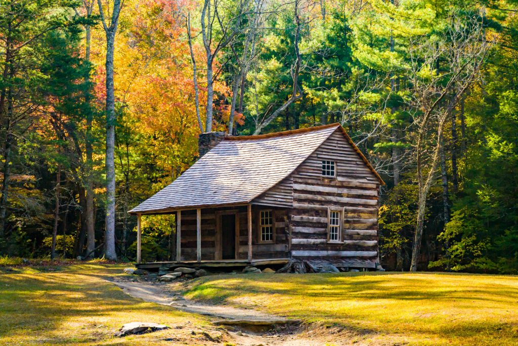 Photo of an old cabin in Cades Cove on a sunny, fall day.