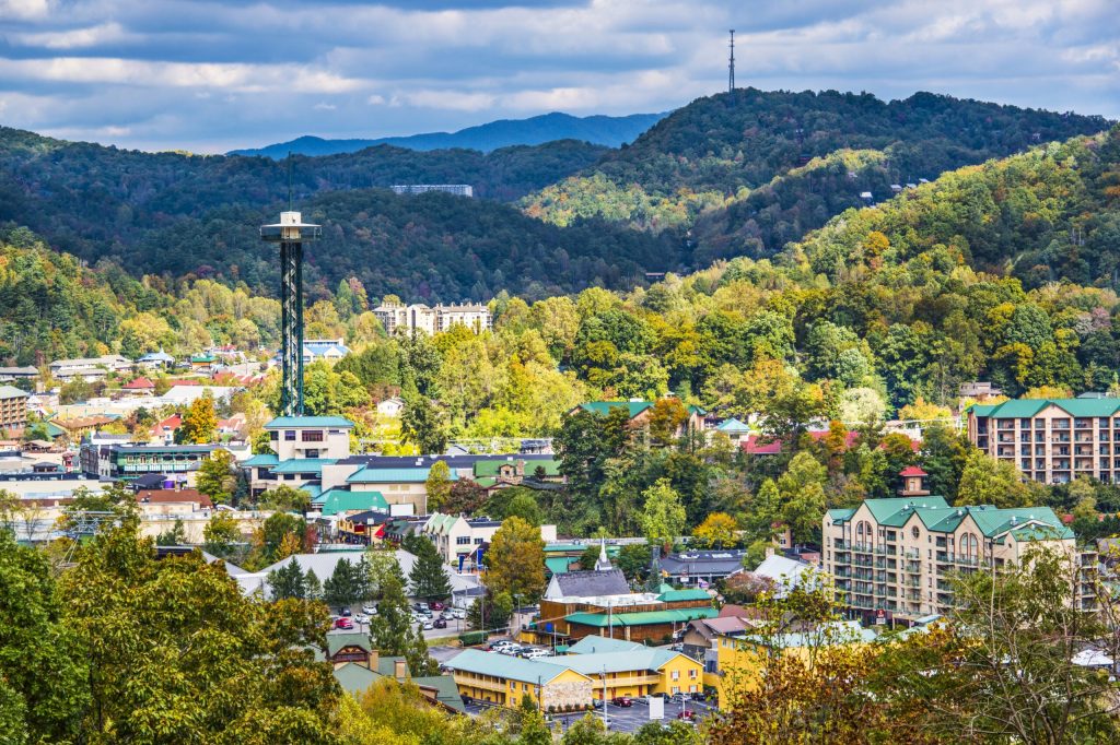 An aerial view of the Gatlinburg Space needle and the surrounding landscape. 