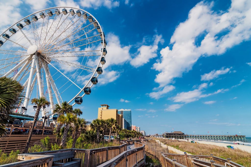 Photo of Myrtle Beach that includes the Skywheel and the beach.