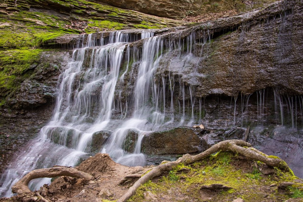 waterfall cascading down rock wall at Natchez Trace State Park