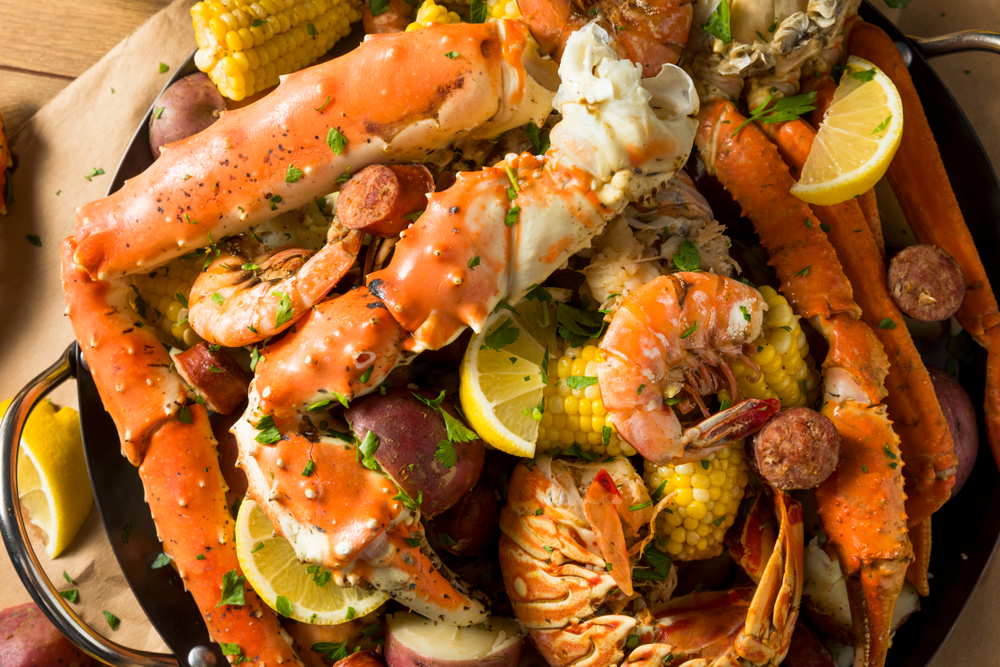 A crab boil like the one you can get at the Crab Shack that is full of crab, shrimp, potatoes, and corn