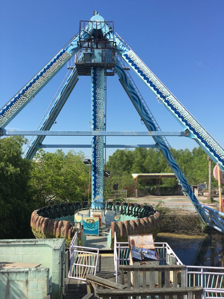 An abandoned swing ride sits empty after Hurricane Katrina, one of the best hidden gems in Louisiana. 