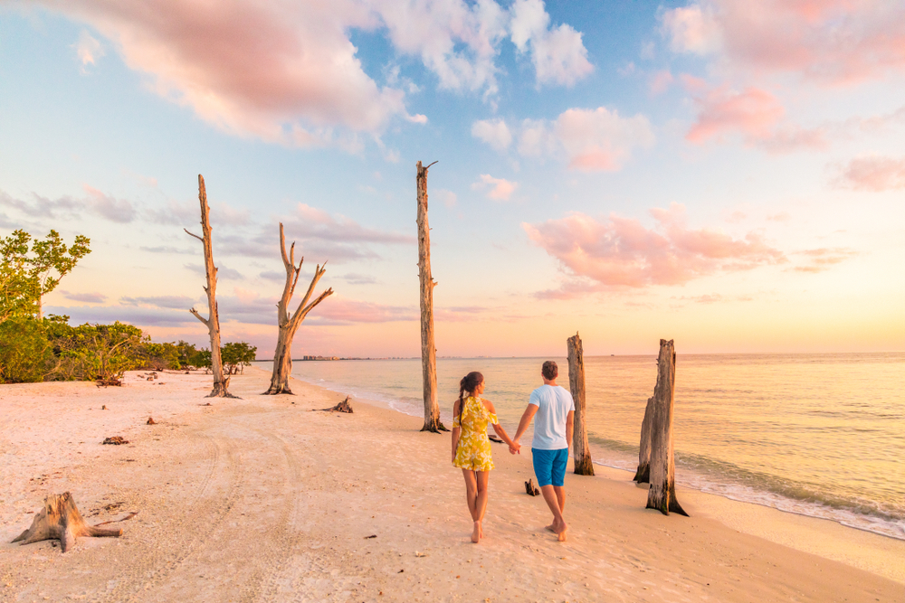a couple walking on the beach in Lovers Key Florida one of the most romantic getaways in the South