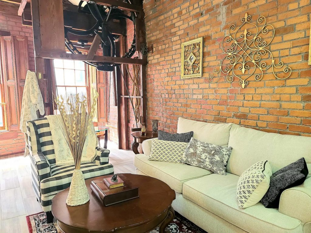 Photo of downtown penthouse Airbnb in New Orleans with 200 year old brick walls.