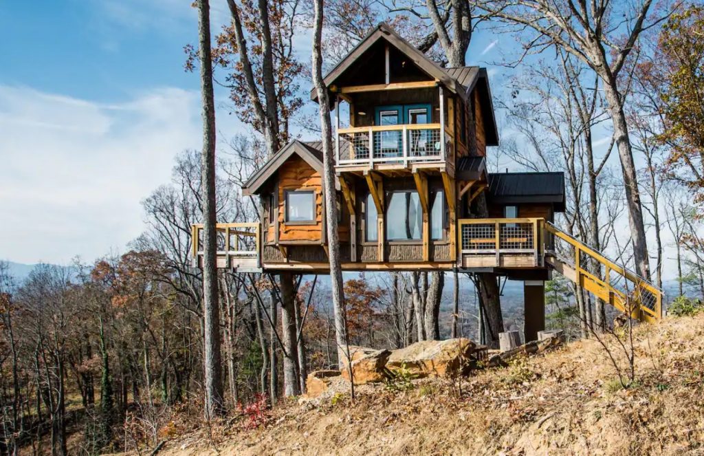A large cabin sitting on the side of a mountain in North Carolina one of the coziest cabins in the South.