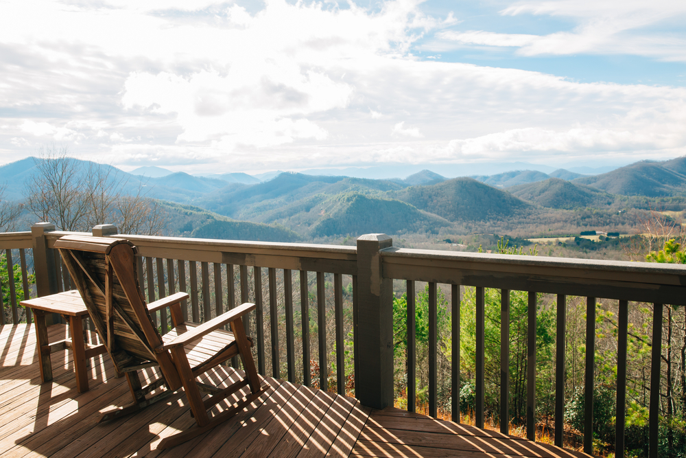 The view from a deck looking out on the Great Smoky Mountains