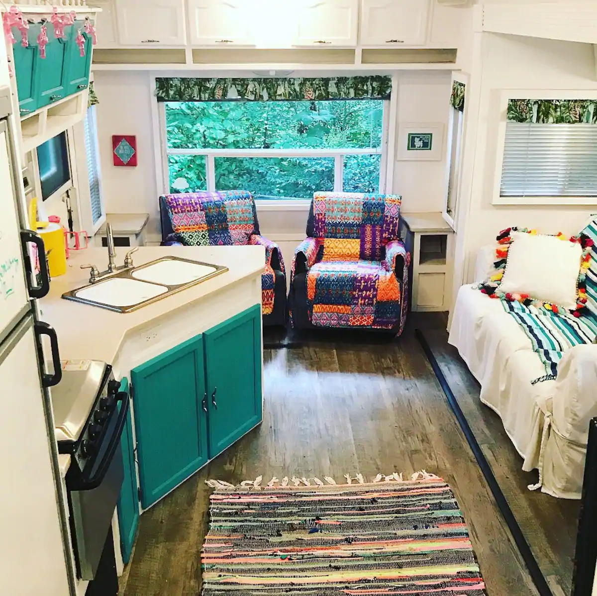 Photo of the brightly colored interior of a camper Airbnb located in Georgia. 