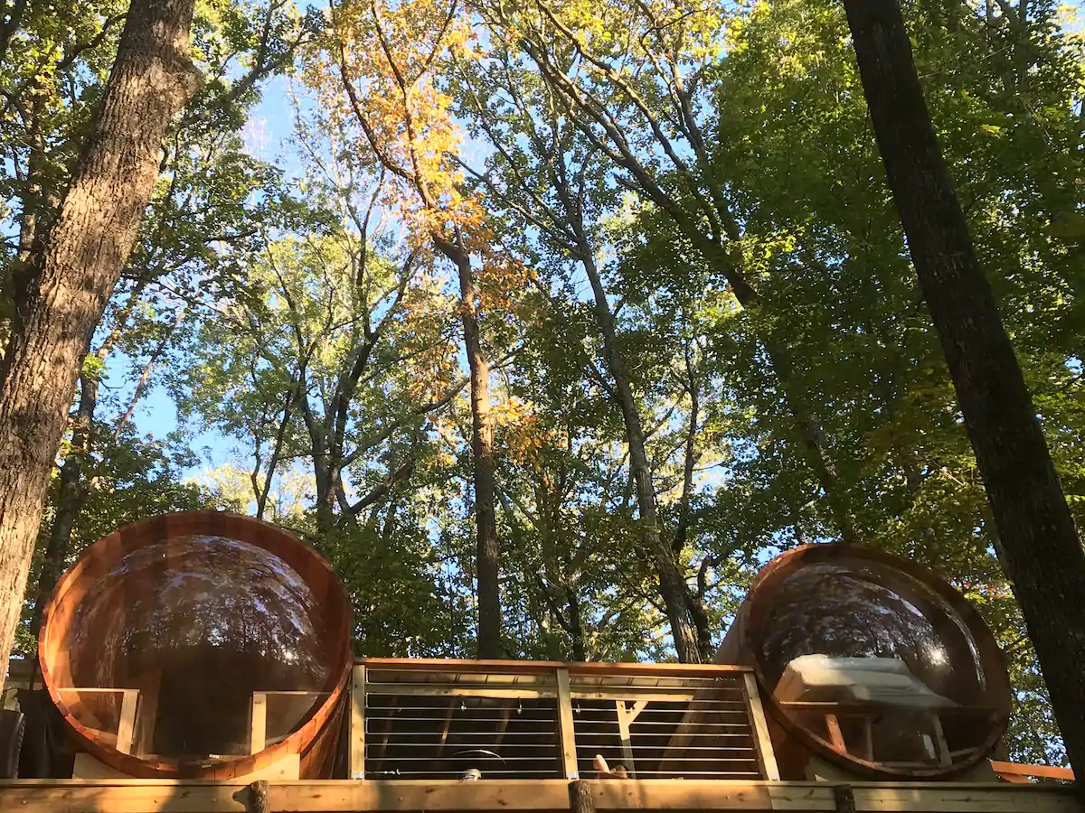 Photo of the exterior of two cedar sleep pods that are located in Georgia.
