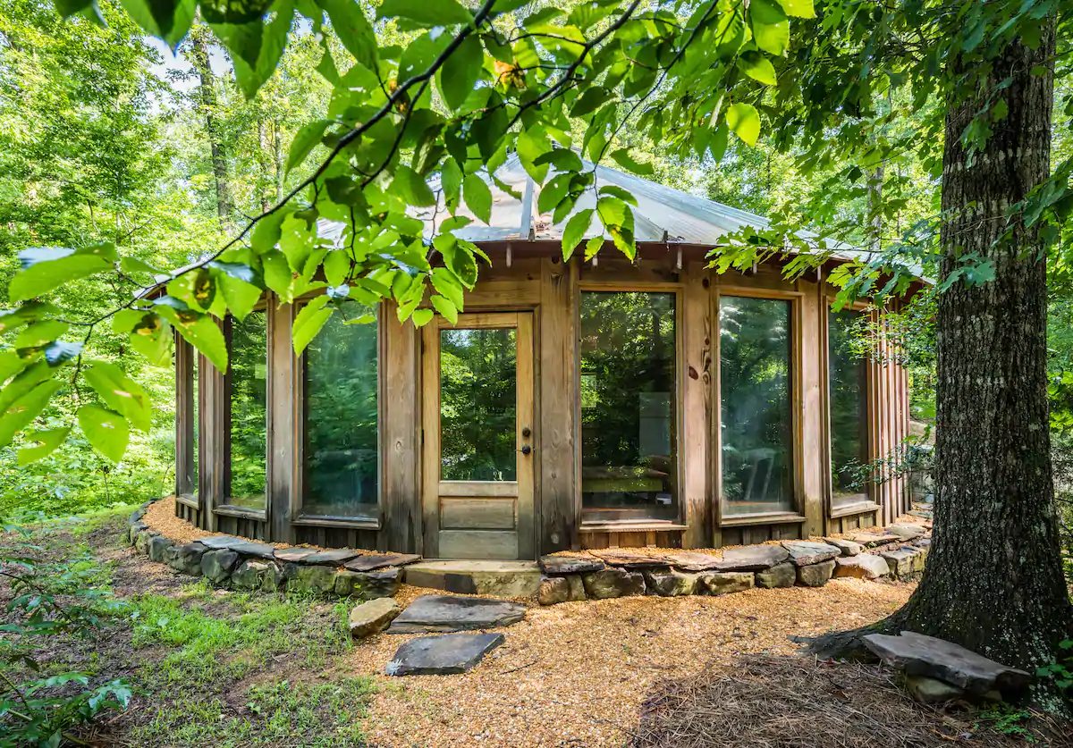 Photo of the exterior of a wooden yurt VRBO in Georgia.