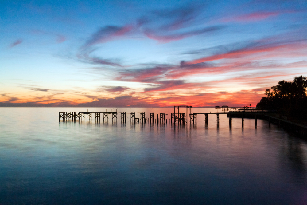 Pretty sunset over Lake Pontchartrain, something you can see on a weekend getaway in Louisiana.