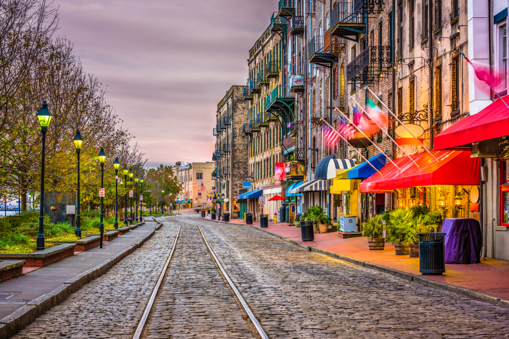 Photo of shops and restaurants in downtown Savannah, Georgia, at sunset.