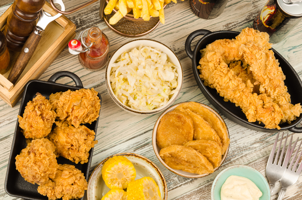 Photo of a classic southern meal of fried chicken and coleslaw served family style, a delicious option at many restaurants in Savannah