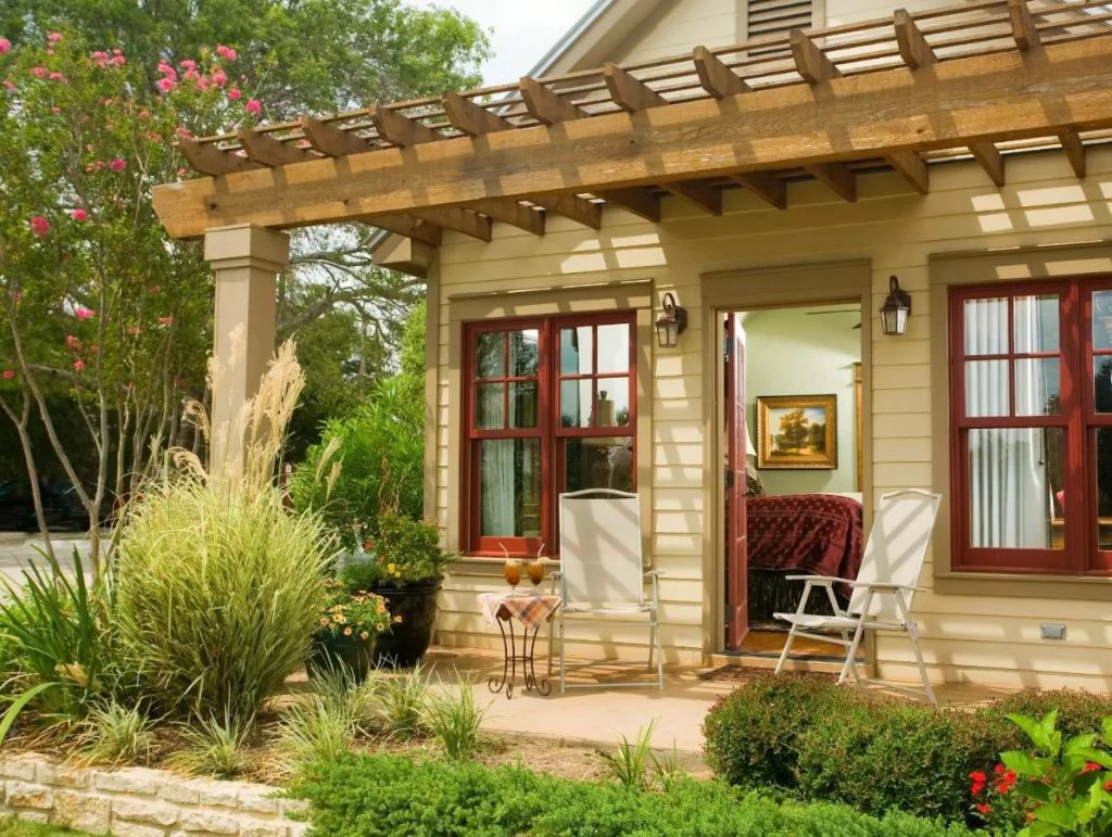 Photo of a guest room with a private porch at the Inn on Lake Granbury, one of the best weekend getaways in Texas.