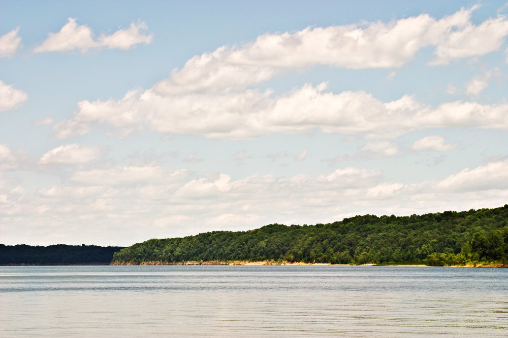 A photo of a clear and sunny day at Green River Lake State Park Beach. 