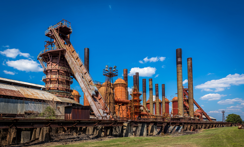 A wide photo of the rusty and abandoned Sloss Furnaces.