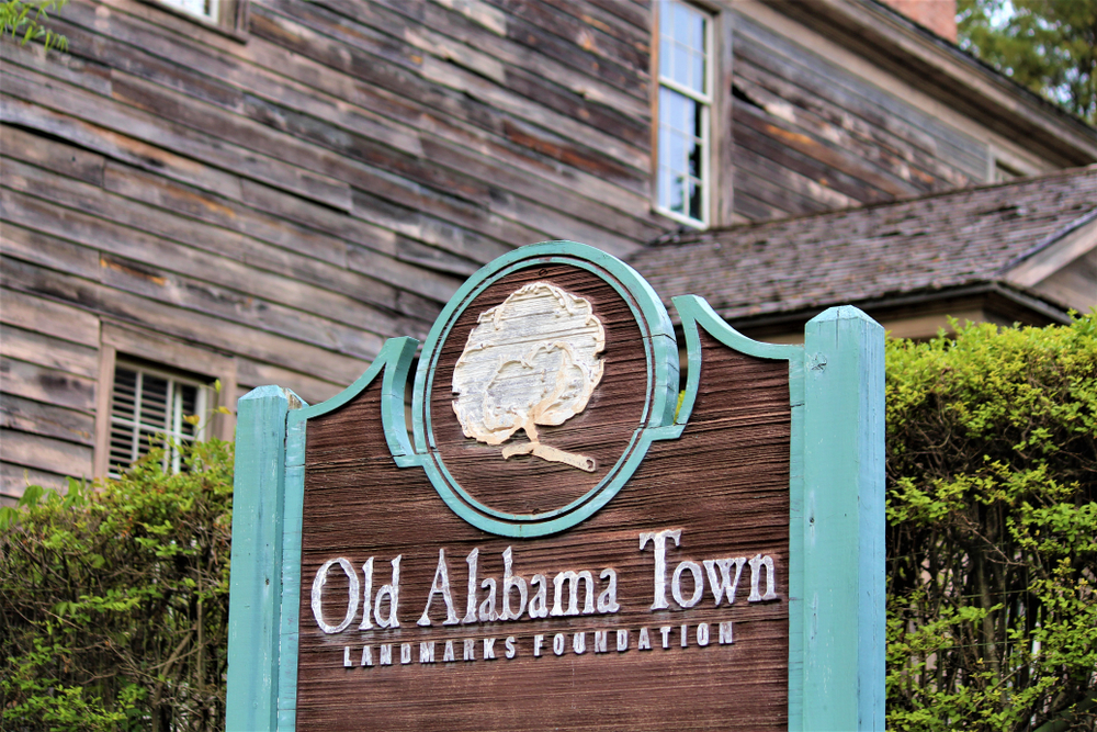 A sign post welcoming tourists to Old Alabama Town credited to Madison Muskopf.