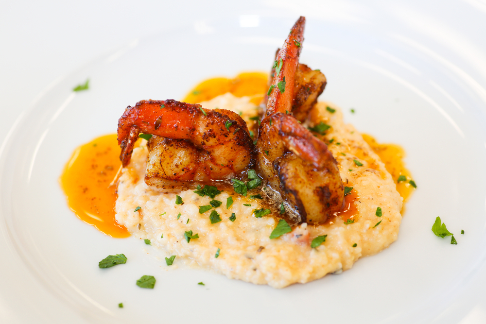 A fancy plating of shrimp and grits 