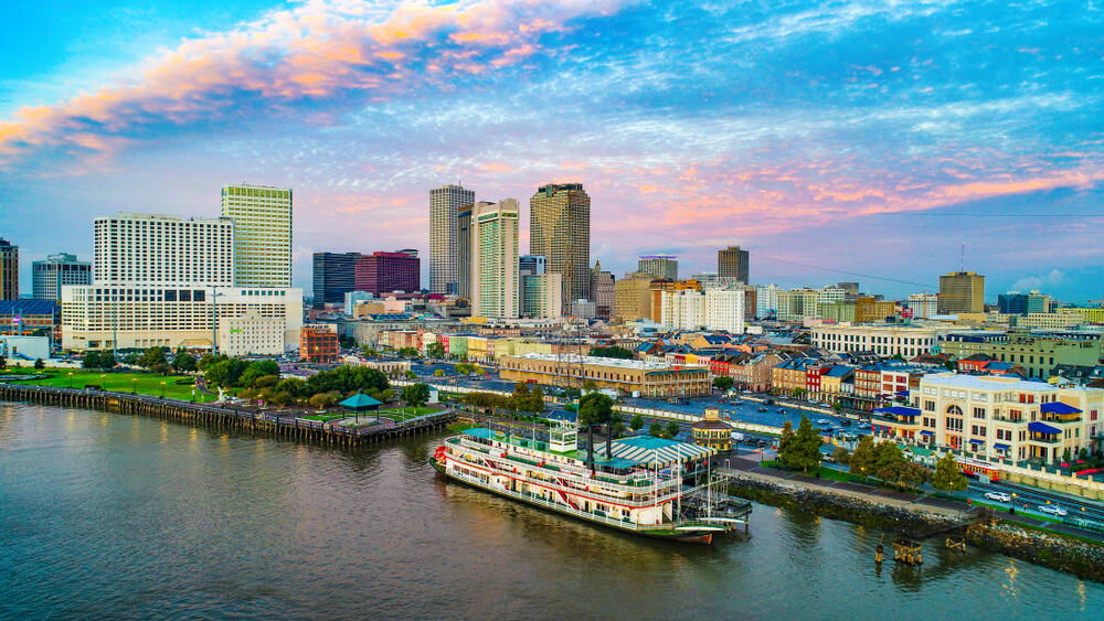 A steamboat on the Mississippi River at twilight in New Orleans