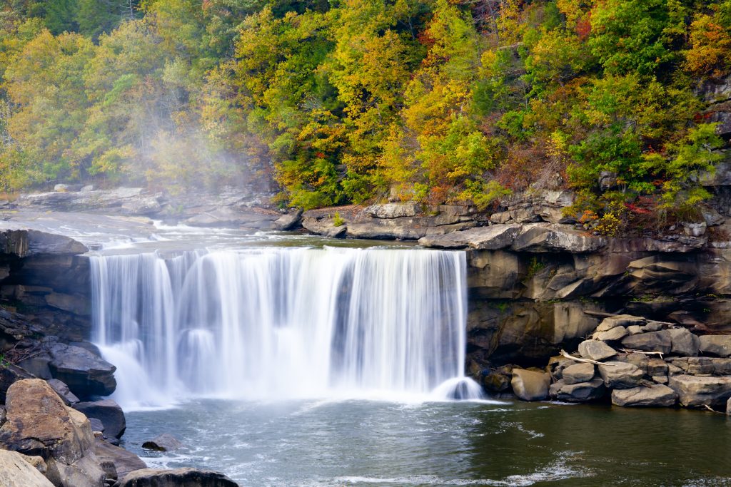 Cumberland Falls creates sheets of water as it crashes down, one of the most beautiful waterfalls in Kentucky.