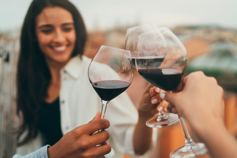 A photo of glasses of wine you can enjoy at the best rooftop bars in Savannah.