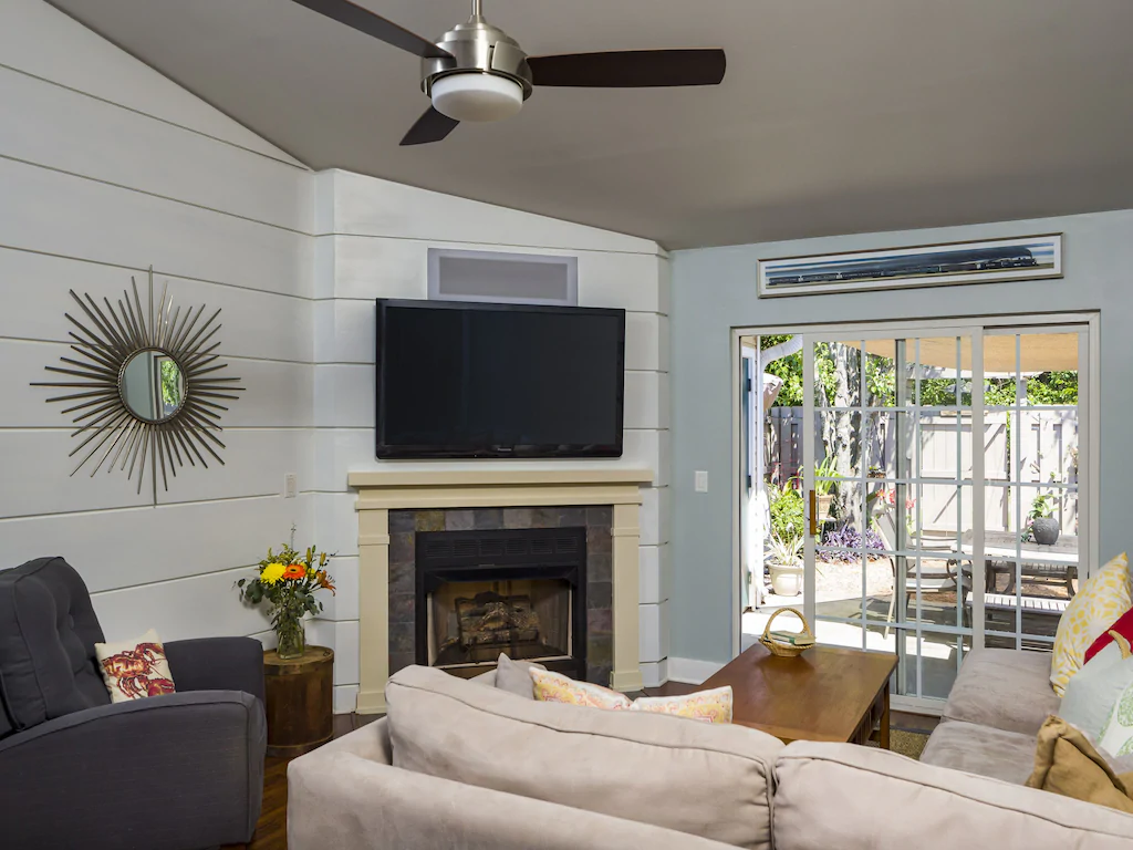 A photo of a living Room with a fireplace in a VRBO in Charleston.