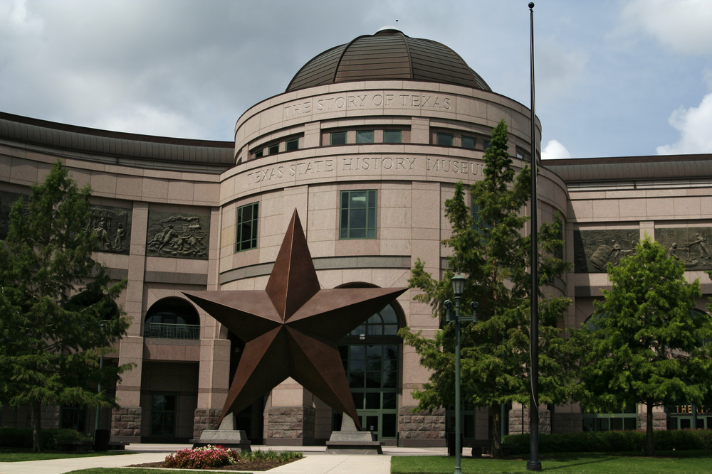 The Texas Star on display at the front of the texas state history museum in texas