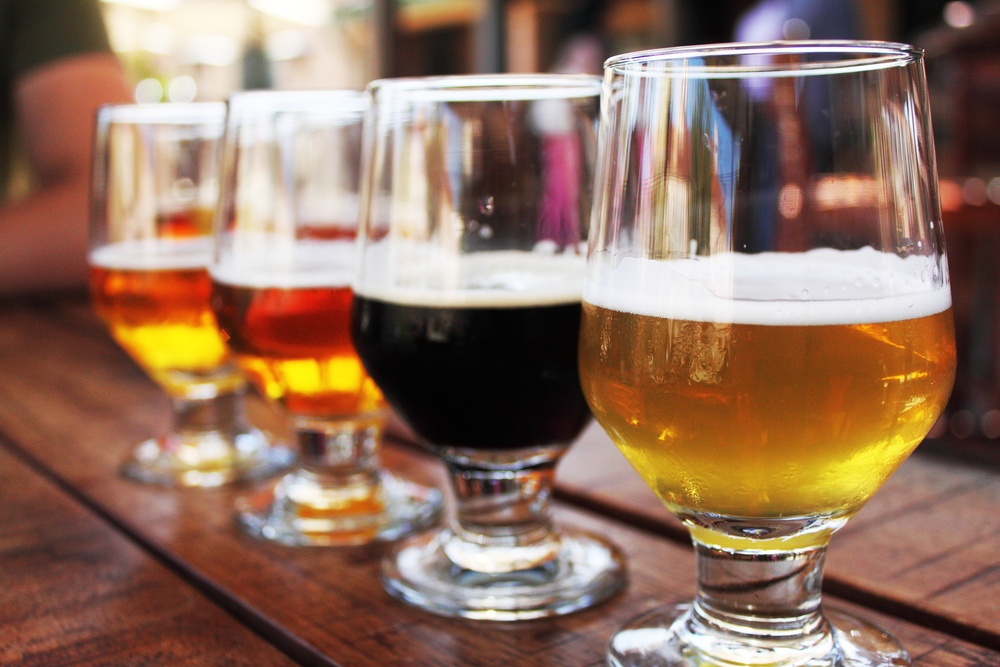 Photo of a beer flight, highlighting Root and Barrel Kitchen.