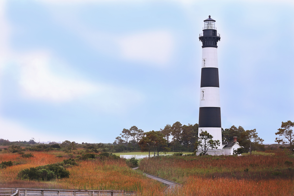 A photo of Bodie Island Lighthouse in the fall located on The Outer Banks of North Carolina.