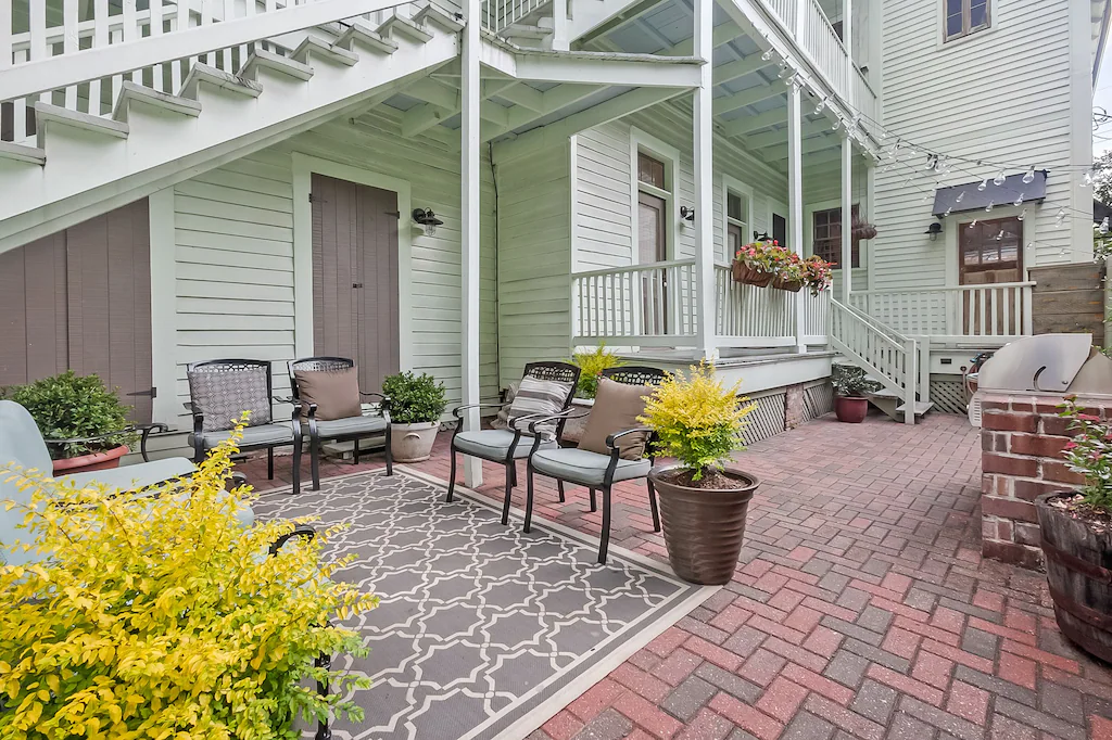 The backyard of this Garden District VRBO is perfect for grilling and chilling