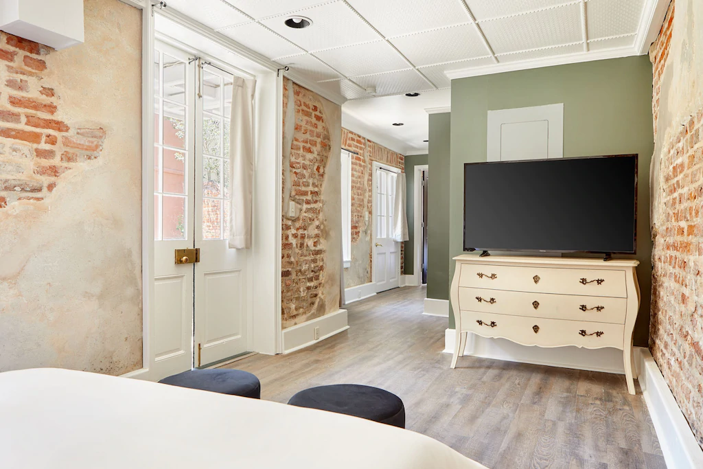 The exposed brick walls give this VRBO on Bourbon Street a historic feel
