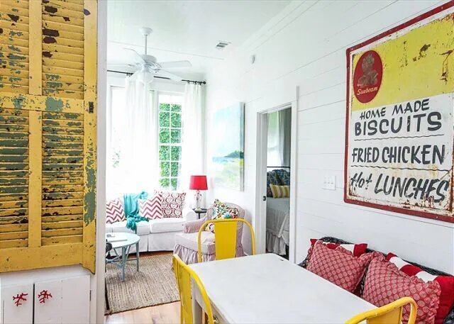 Phot of the living room decorated with antiques at The Cottage on the Green, one of the cutest VRBO in Savannah