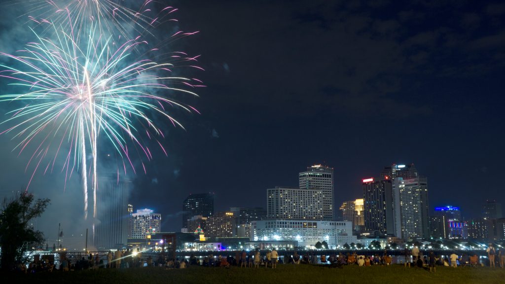 Fireworks illuminate the New Orleans skyline for July 4th, the best time to visit New Orleans