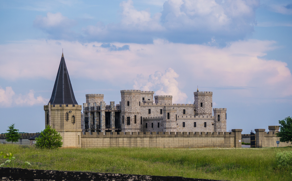 Photo of the southern Kentucky Castle surrounded by its border wall and watch tower. 