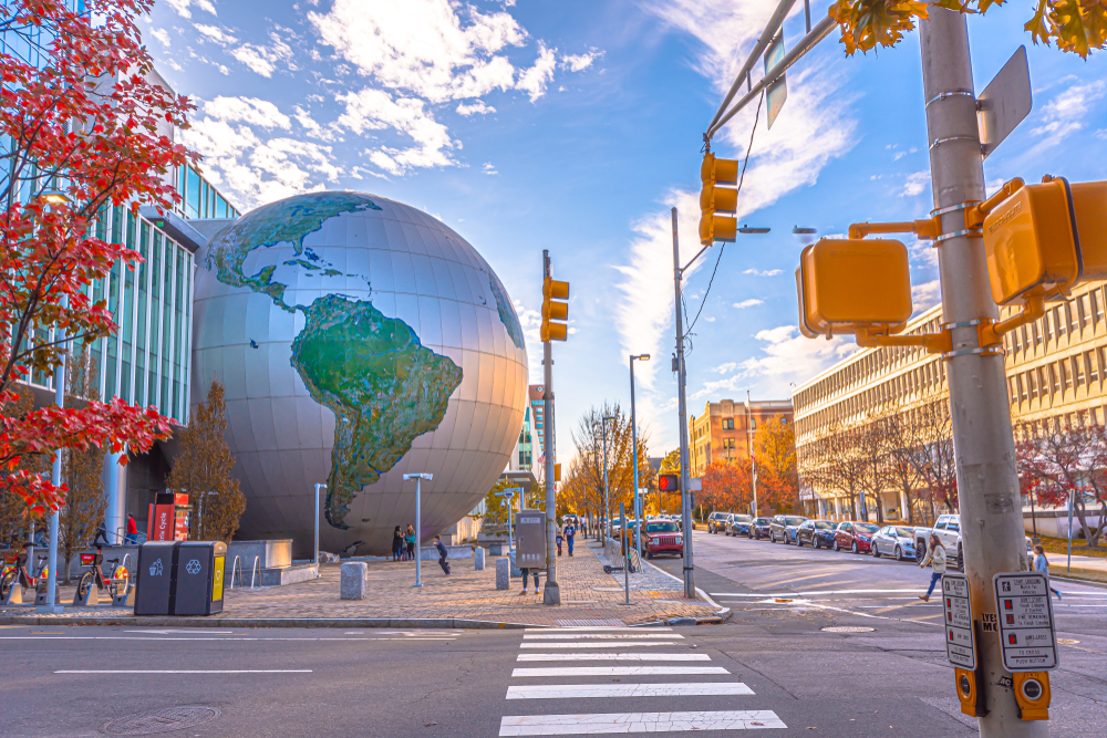 city streets and a large globe outside museum