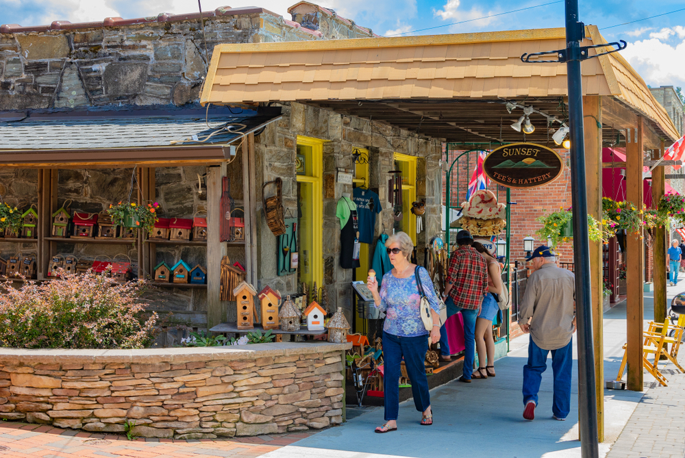 shops and people walking along sidewalk