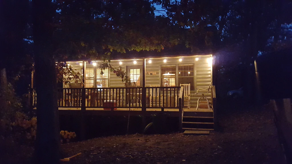 A cabin in the evening decked in lights