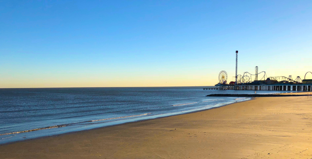 beach with an amusement park in the background