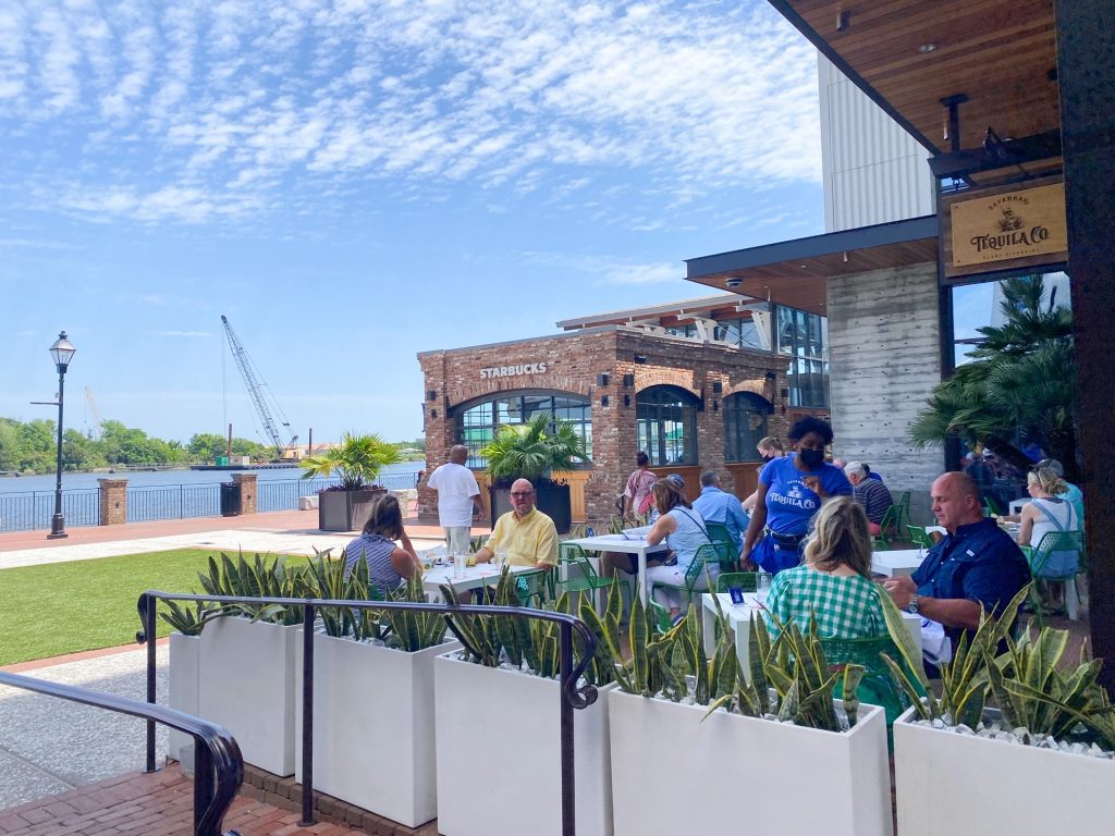 Guests enjoy food and drinks on the patio of the Savannah Tequila Company lawn. 