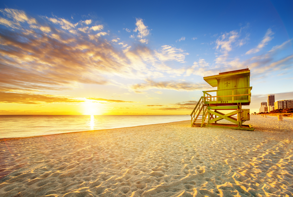 lifeguard stand on the beach at sunset