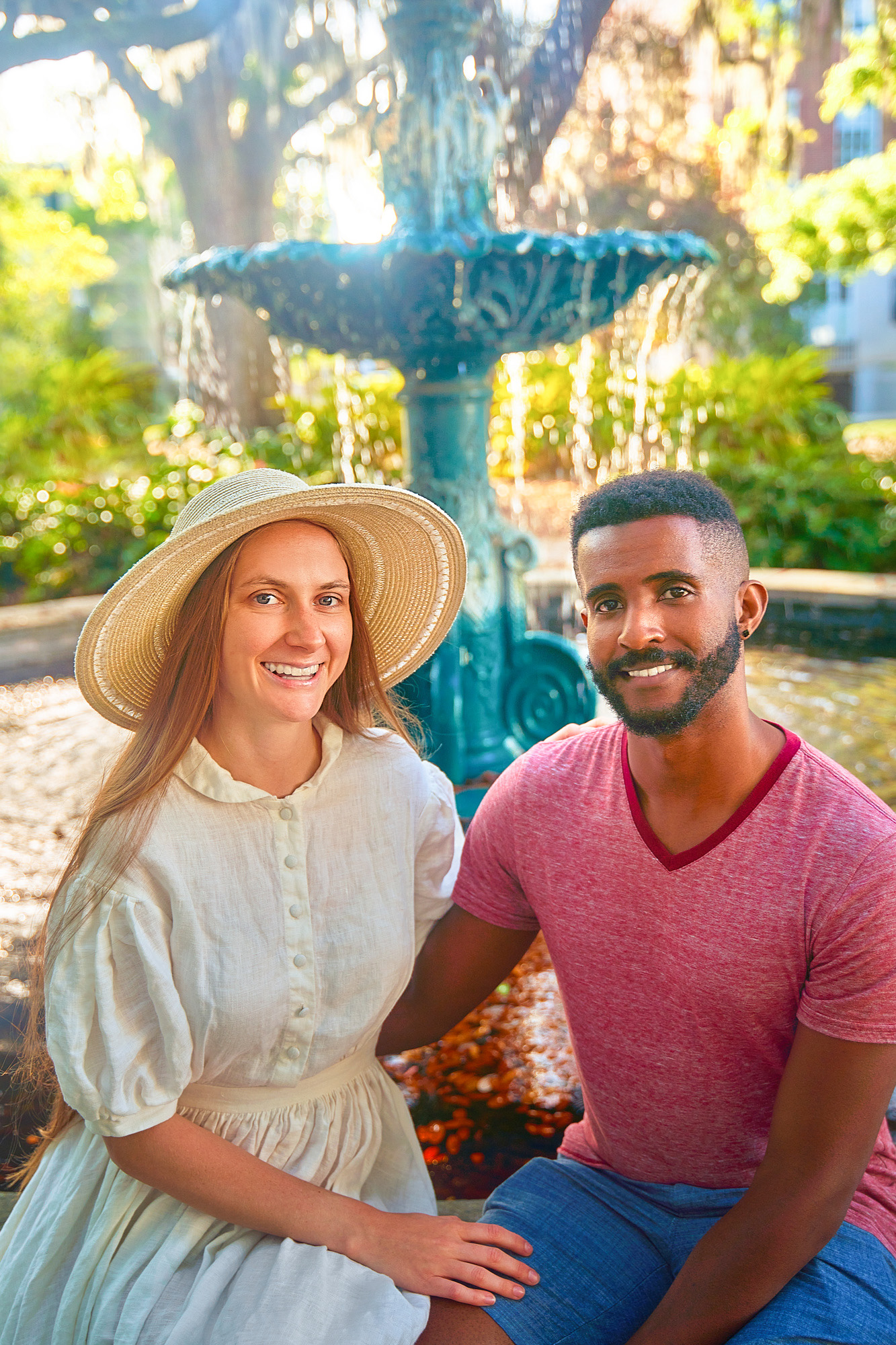 Victoria Yore and Terrence Drysdale sitting in front of a fountain in Savannah Georgia for Southern Trippers About Me photo