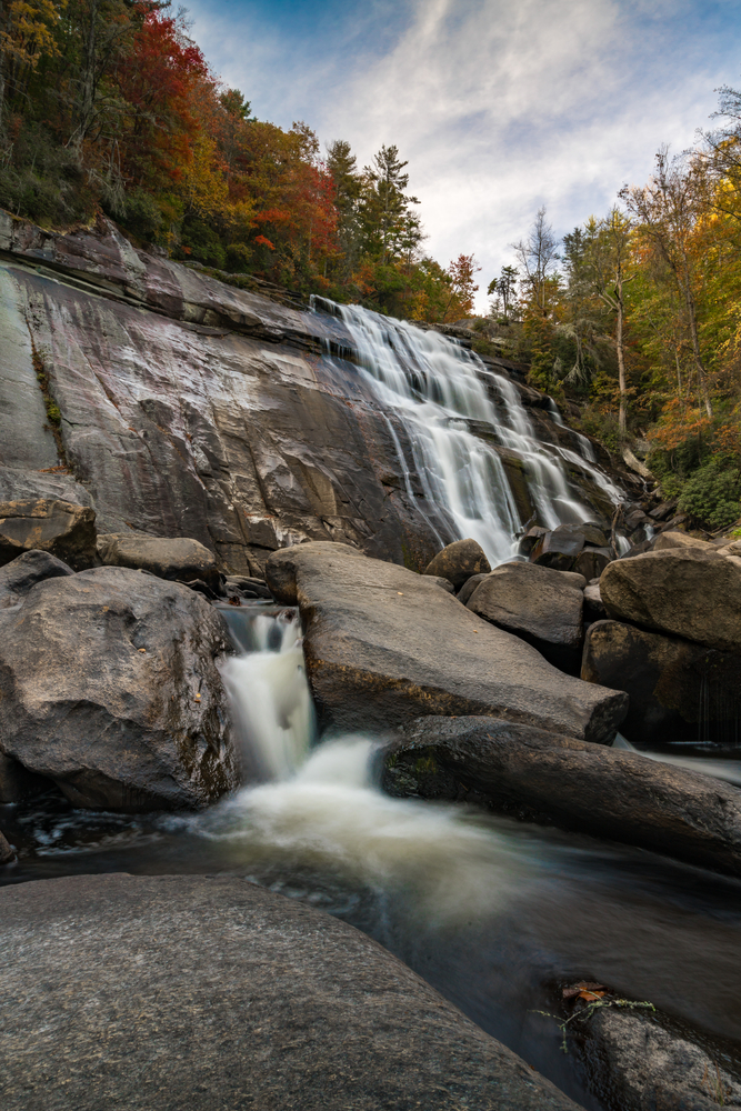 Rainbow Falls flowing down among rocks showing off one of the best waterfalls near Asheville.