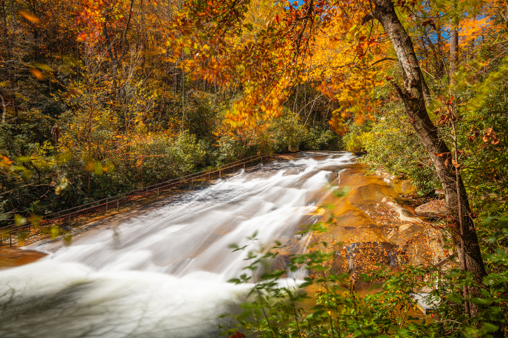 Sliding Rock nestled in a fall forest.