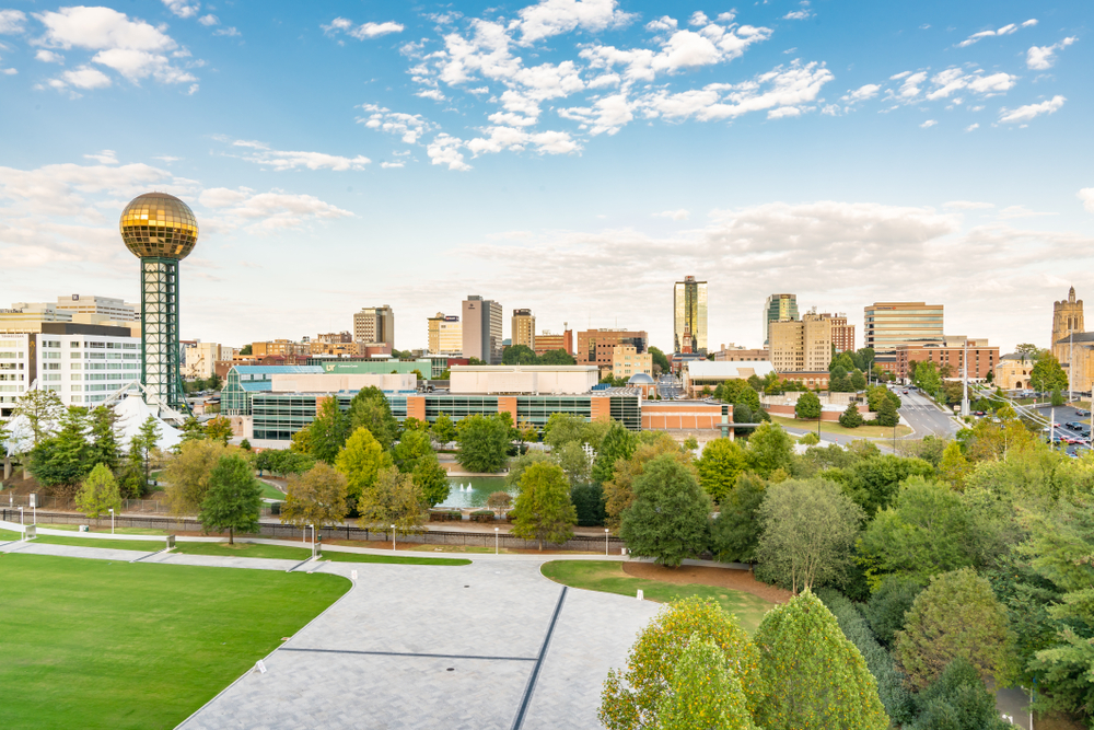 A panoramic photo of Knoxville with a view of the golden dome of the Sunsphere.