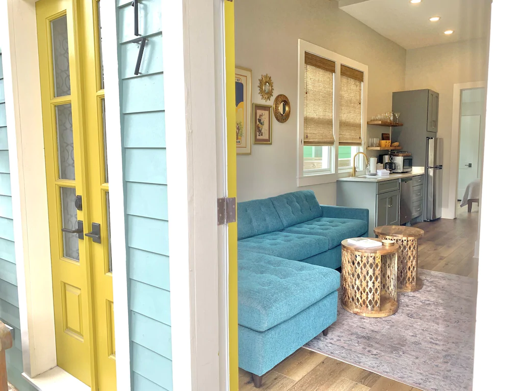 The bright yellows and blues make this Charming Bungalow a quaint place to stay in the French Quarter.