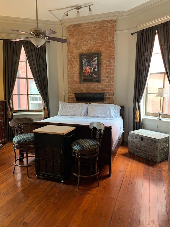 With wood floors, exposed brick, and an unbeatable view, this is one of the best airbnbs in New Orleans.