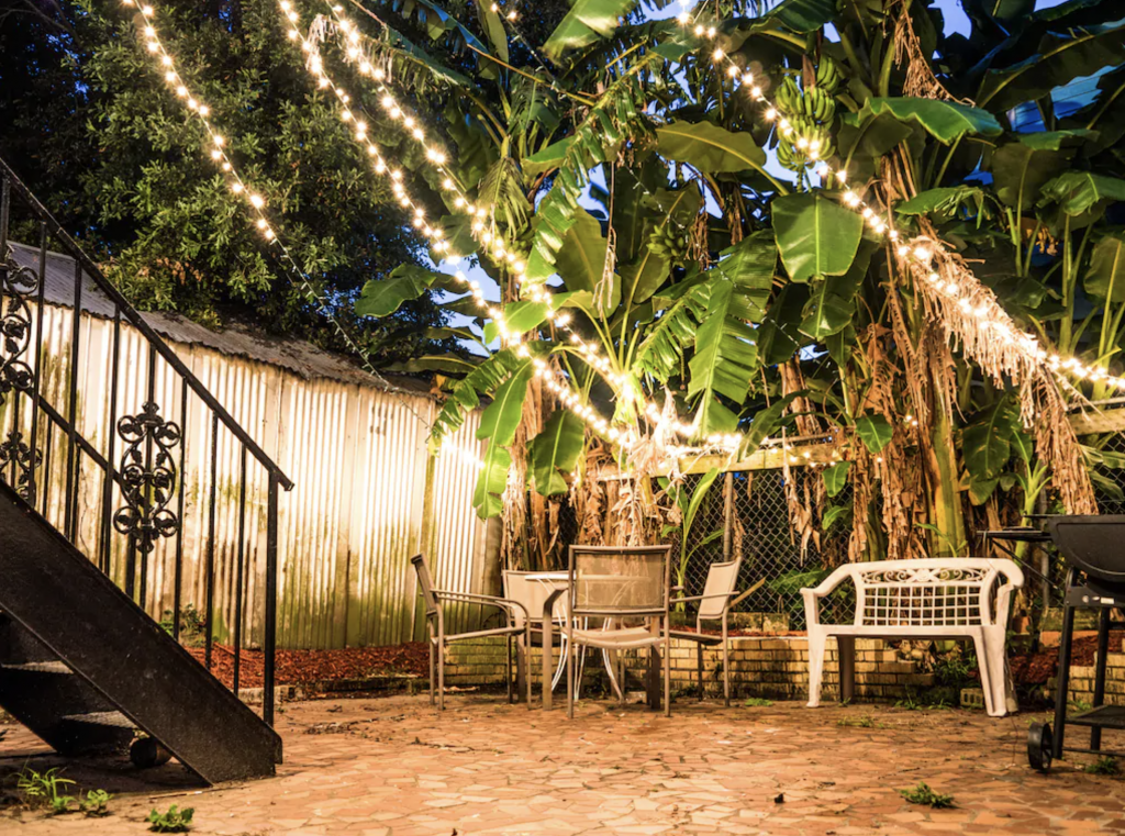 A delightful courtyard has a grill, perfect for nightcaps at one of the best airbnbs in New Orleans.