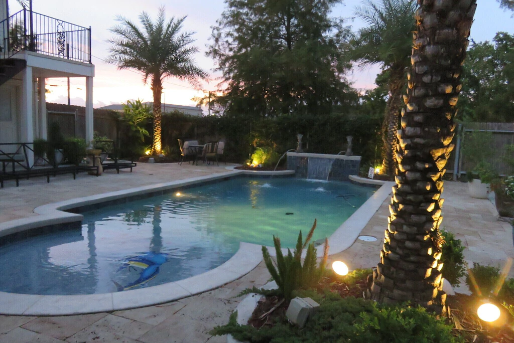 A gorgeous pool will add to the festivities in the aptly named Mardi Gras Cottage, one of the best airbnbs in New Orleans.