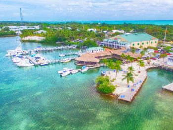 islamorada on a sunny day with crystal clear blue waters and boats